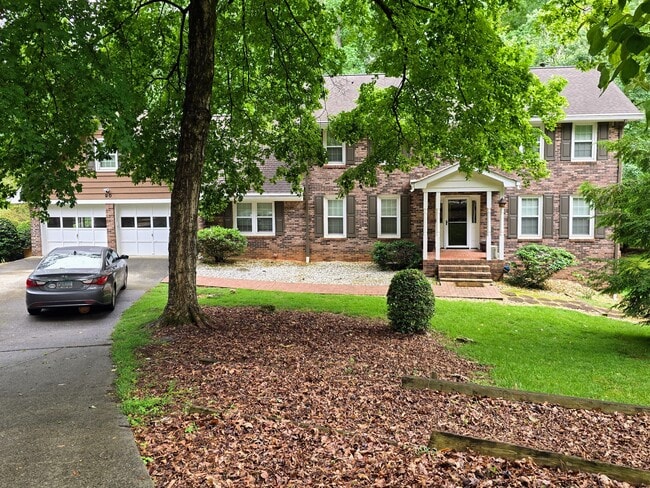Brick front with old growth trees - 90 Martin Point Ct
