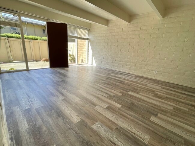 Downstairs Living Room looking out to patio - 451 Dela Vina Ave