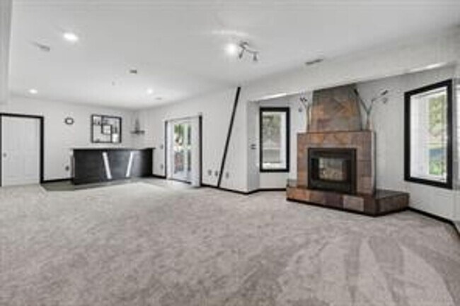 Building Photo - Spacious 5-Bed Walkout Home with Over 3,50...