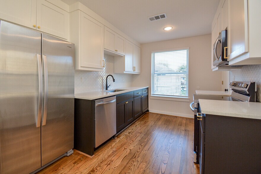 Galley kitchen with huge new fridge and natural lighting - 2916 Arbor St