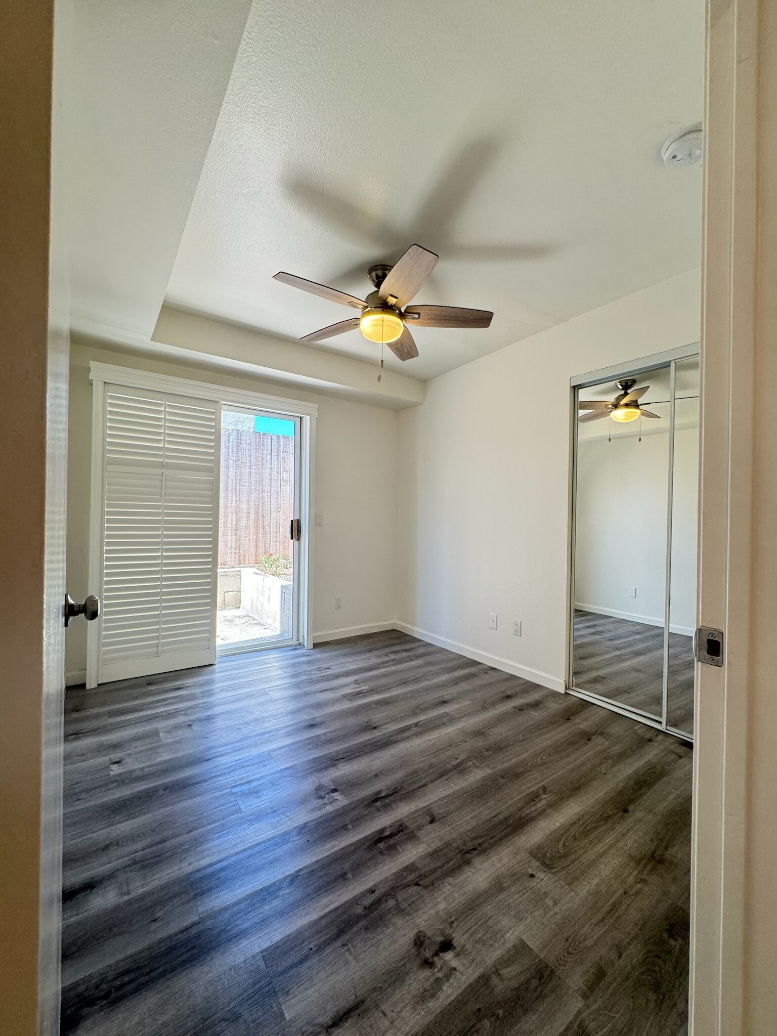 smaller second bedroom looking out on patio. 10 feet 5 inches in length. 8 foot 6 inches wide - 1757 17th St
