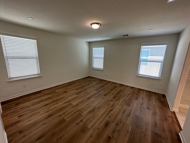 Building Photo - Stunning 4 Bedroom, 3 Bath Gated Community W/ Solar