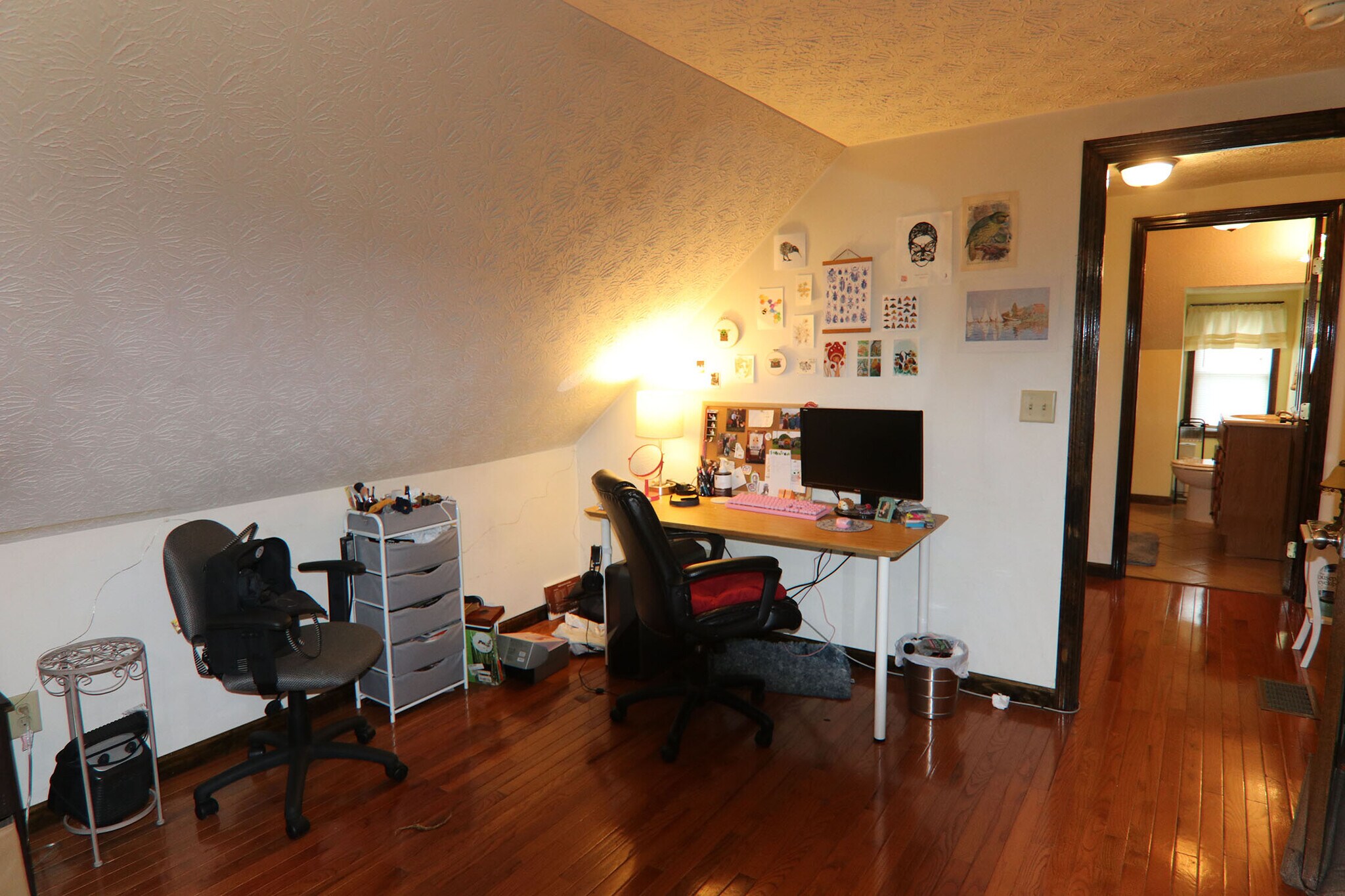 View 3 of 3rd floor bedroom with window A/C unit. 3rd floor full bathroom is also visible - 374 E Oakland Ave