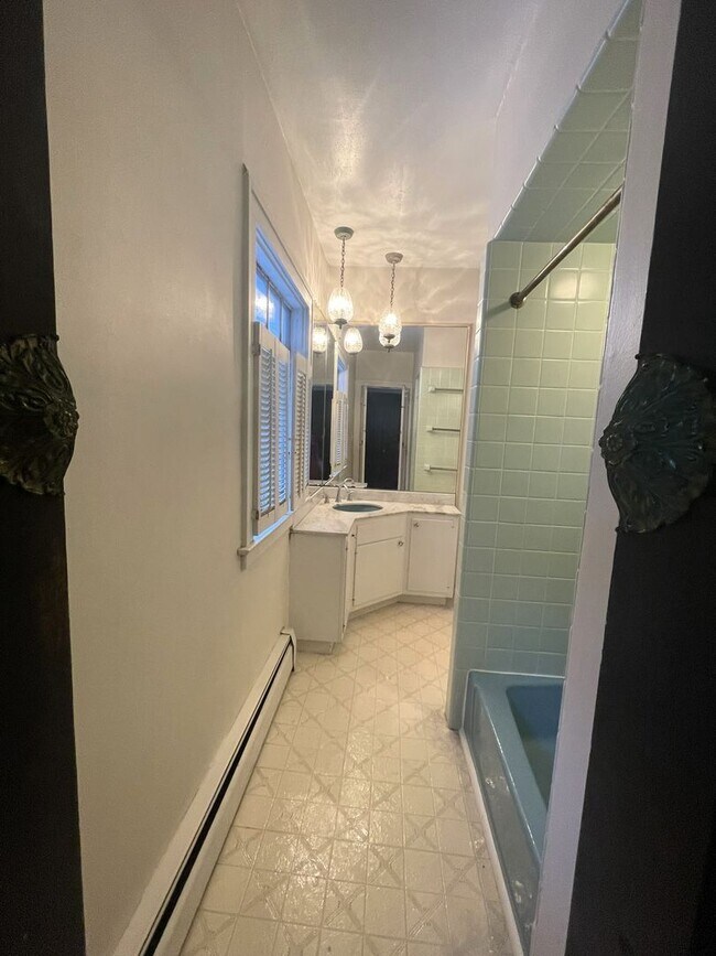 Building Photo - One Block to the Diag! Charming Home with Private Courtyard + Parking