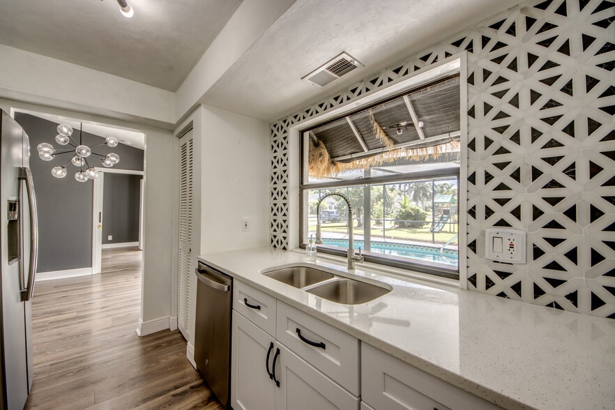 Newly updated kitchen overlooks the pool with pass thru window! - 2316 Everest Pky