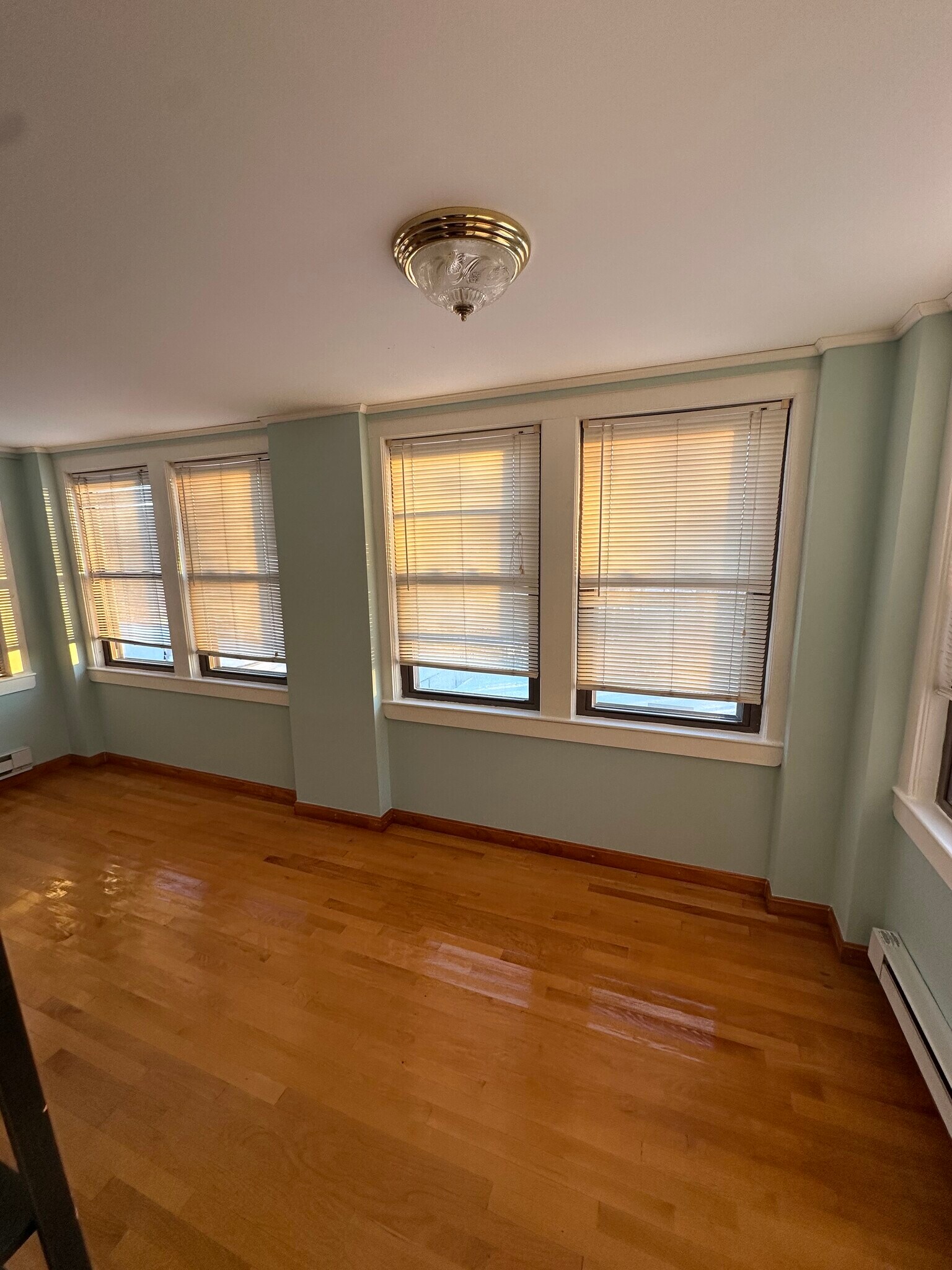 Beautiful three season back porch with a view of the Boston skyline. - 202 Orient Ave