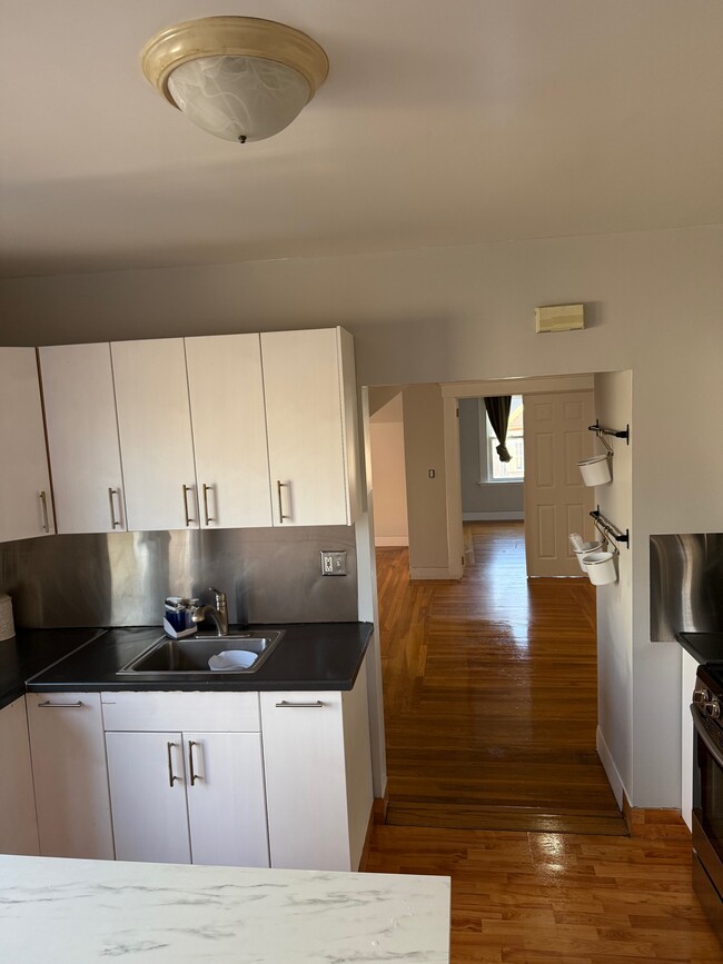 Kitchen looking into living area - 92 Hubinger St