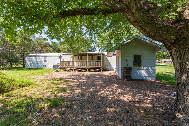 Building Photo - Updated mobile home on acre lot with garag...