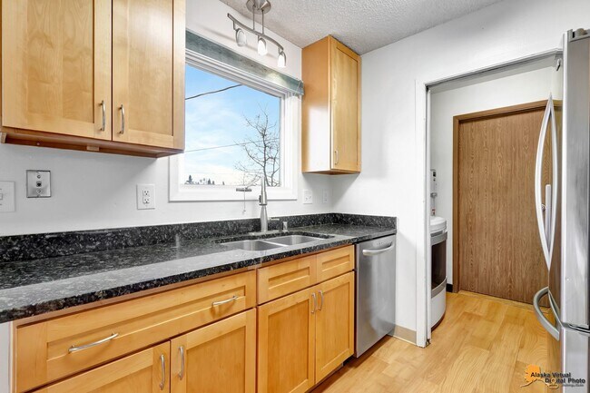 Building Photo - Cozy Abbott Loop Single Family Home w/ Garage & Fenced in Yard