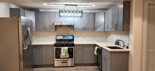 Spacious kitchen with modern countertop - 2160 22nd Ave