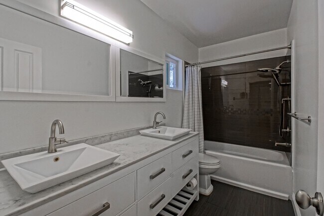 Building Photo - REMODELED, BRIGHT & AIRY HOME ON ONE OF TH...