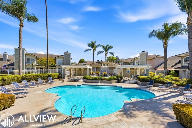 Building Photo - Fully Renovated 2 Bed Townhome with Private Patio, 2-Car Garage & Community Pool