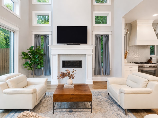 Relax in this light-filled living area featuring comfortable seating, a contemporary fireplace, and - 916B N 6th St
