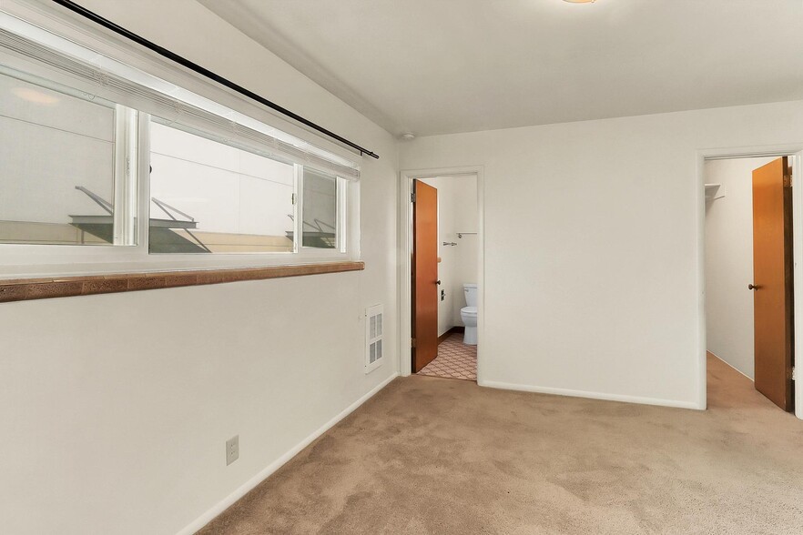 Large Bedroom, looking into walk in closet and bathroom. - Birch Tree Apartments