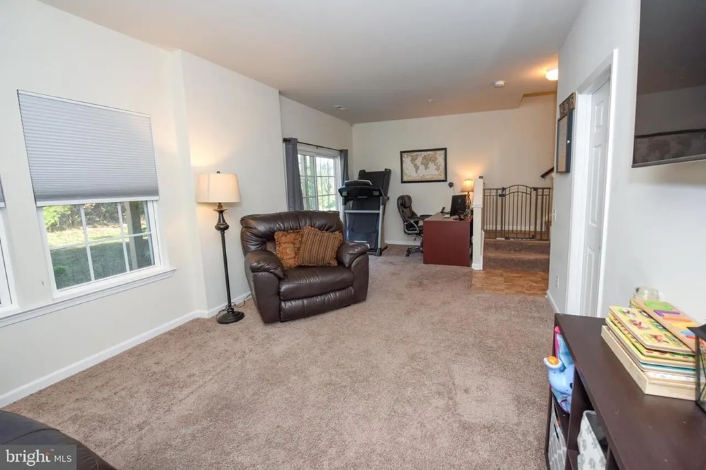 Additional first-floor living space just inside the garage entry—ideal for a home office, gym, or pl - 1736 Beacon Ln