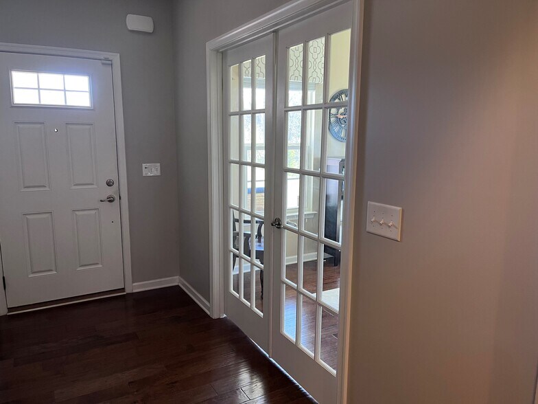 This is looking back towards the front door into the office/den. - 7736 Tranquil Trl