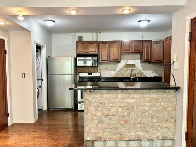 Building Photo - Condo with free heat! In-unit laundry, har...