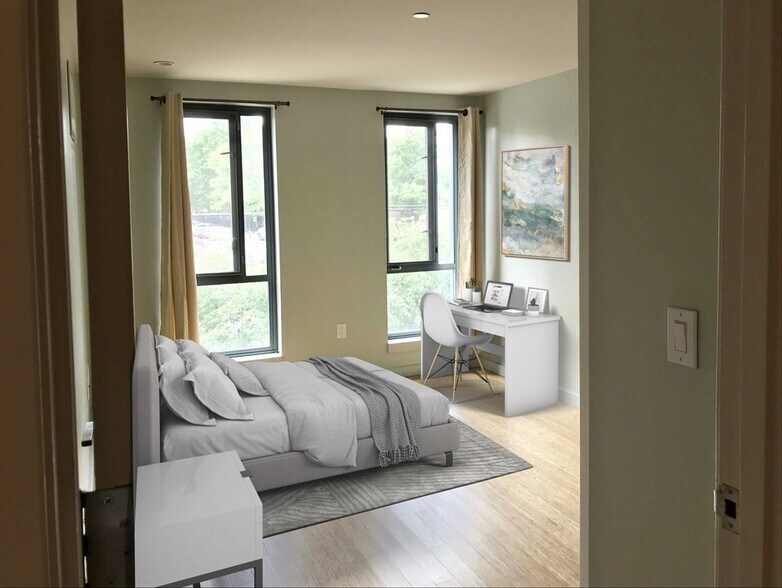 Sunny large bedroom oversize windows overlooking a community garden - 691 Massachusetts Ave