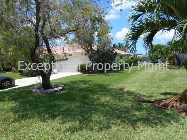 Building Photo - Spacious Home with Luxurious Primary Suite + Den on Oversized Gulf Access Lot!