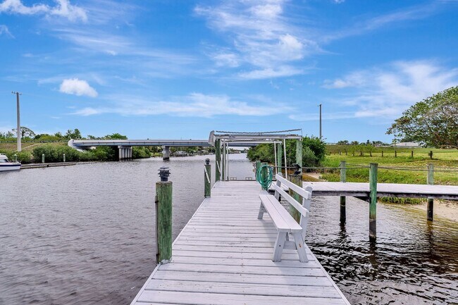 Building Photo - A BOATER'S PARADISE WITH THIS STUNNING 3 BEDROOM, 2 BATH WATERFRONT POOL HOME W/DOCK & BOAT LIFT ...