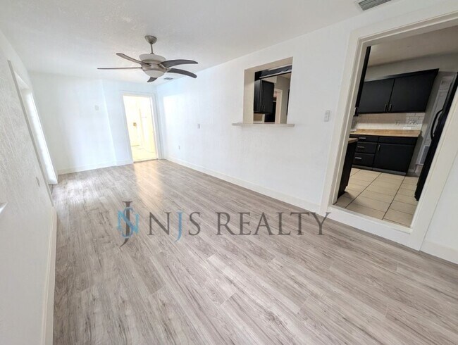 Building Photo - Beautiful 4/2/2 home with a POOL, 1700 Sq. Ft. with fenced yard, TONS of renovations