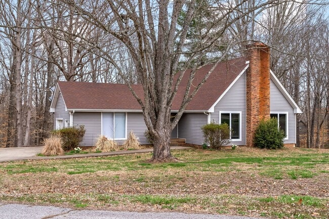 Primary Photo - Lovely home on beautiful, wooded corner - Just Reduced