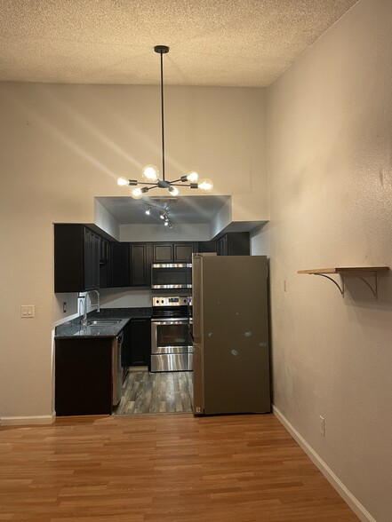 kitchen with new fridge - 250 Del Verde Cir