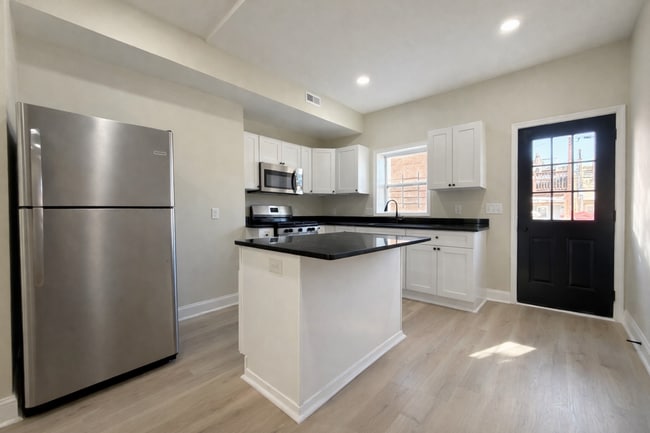 Building Photo - Modern 3BR Rowhome with Finished Lower Level & Rear Deck