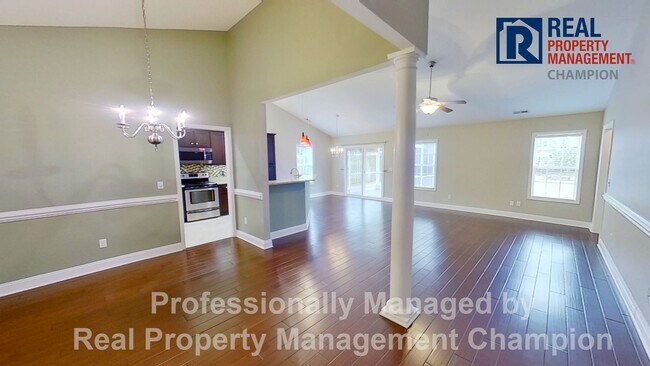 Building Photo - Beautiful home boasts open floorplan, screened porch, and spacious fenced yard