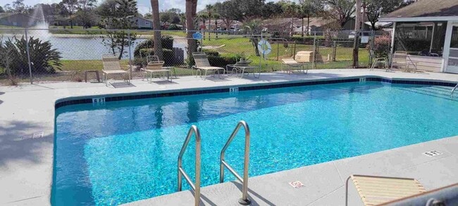 Building Photo - SPACIOUS, FIRST FLOOR CONDO WITH BIG FENCED IN PATIO IN THE LOVELY COMMUNITY OF QUAIL RIDGE!