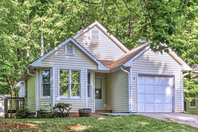 Building Photo - NW - Updated Home with Granite Counter-tops, Fire Place, Deck, Storage Building, Garage!