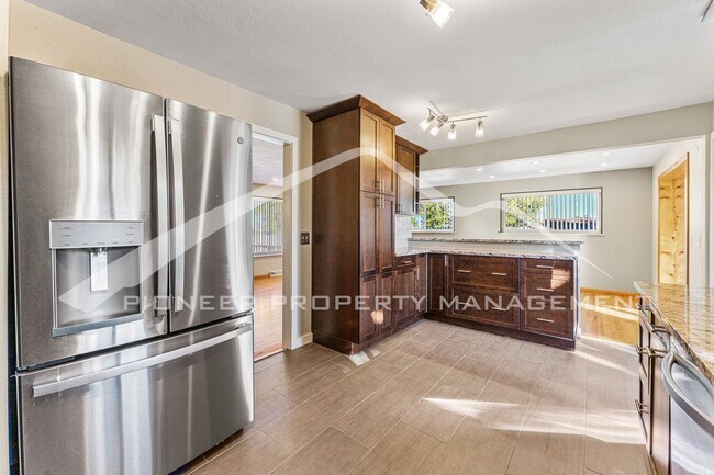 Building Photo - Spacious Home with Natural Light & Fenced Backyard