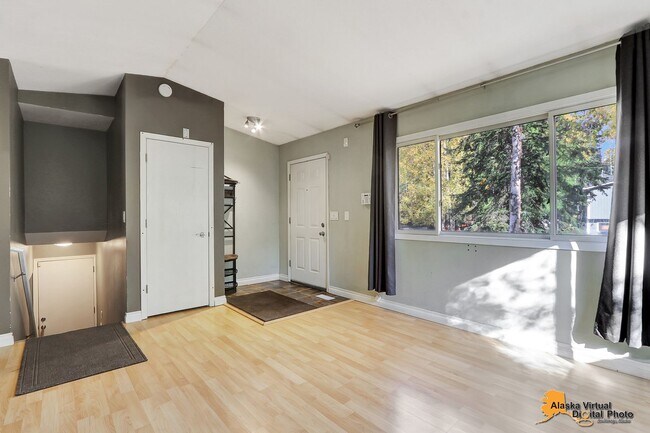 Building Photo - Eagle River Home w/ Fenced Yard, Sunroom, and Garage!