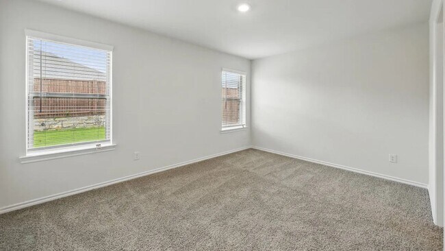 Building Photo - Beautiful new 4-bedroom, 2-bath home with an open floor plan, granite kitchen, two-car garage, an...