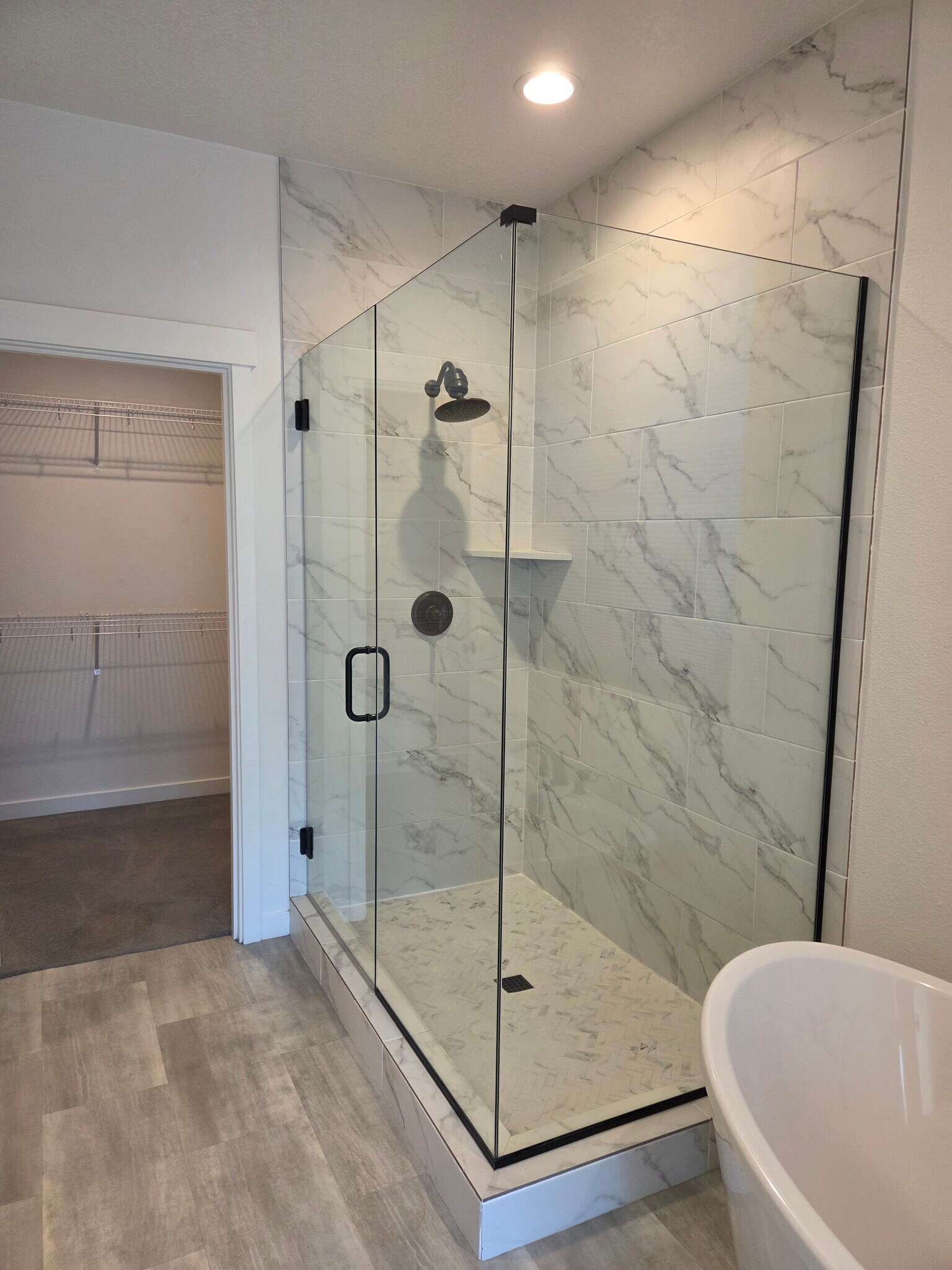 Primary bathroom shower - 5450 NW Stardown Dr