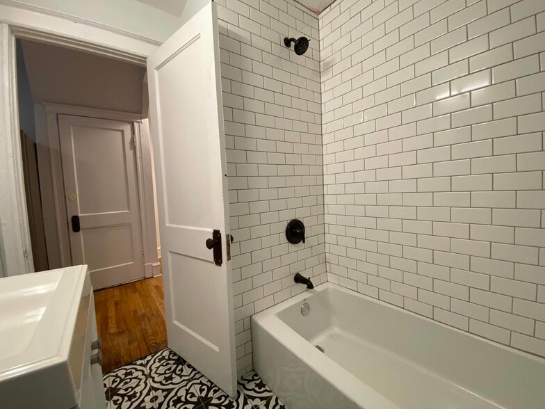 Subway tile tub surround! - 5017 S Broadway