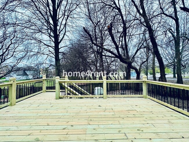 Building Photo - Blue Valley Schools w/ Wood Floors, Finished Basement and a Peaceful, Private Fenced Yard!