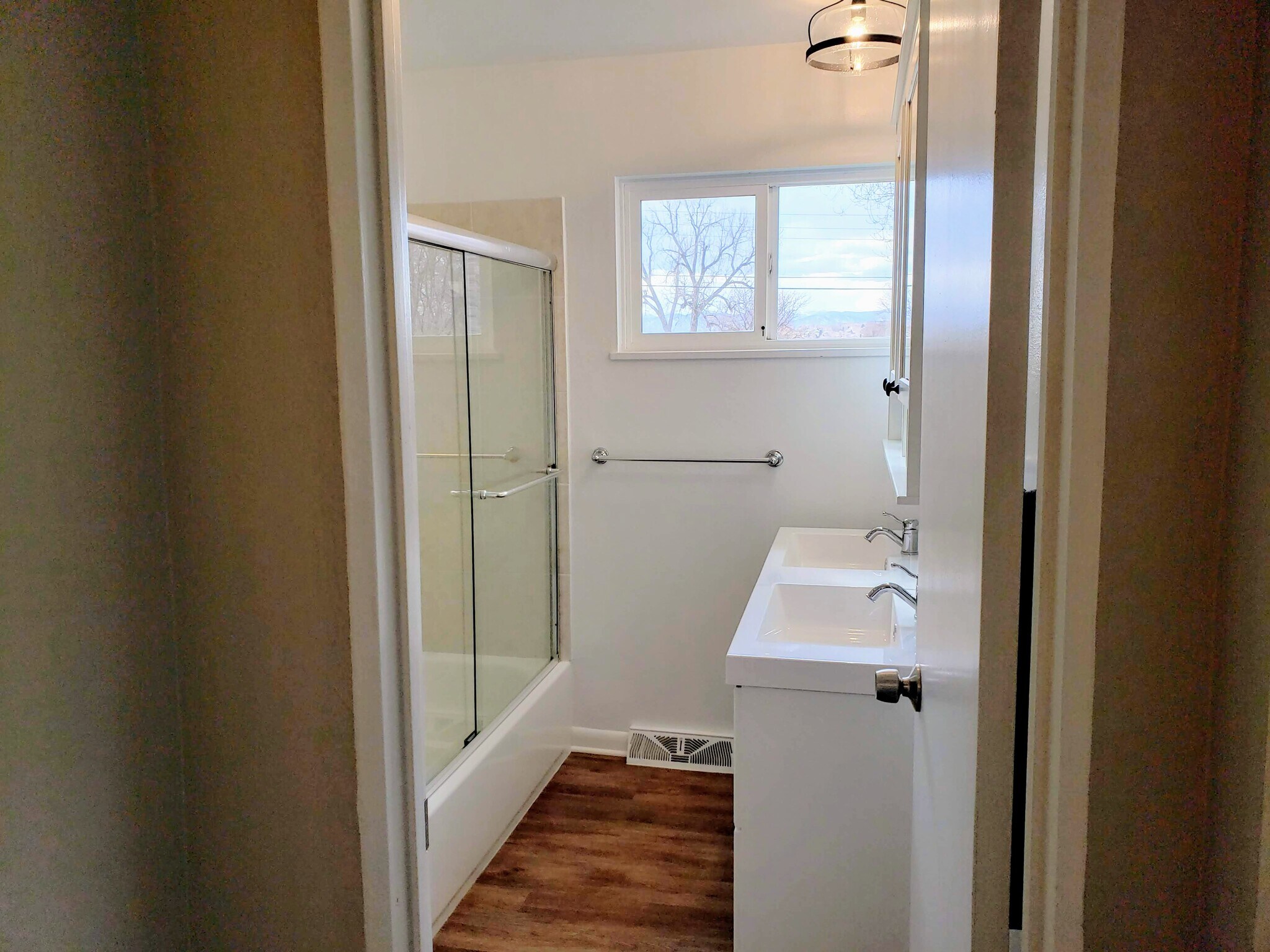 Bright and clean bathroom, newly updated with ample storage - 3155 S Fox St