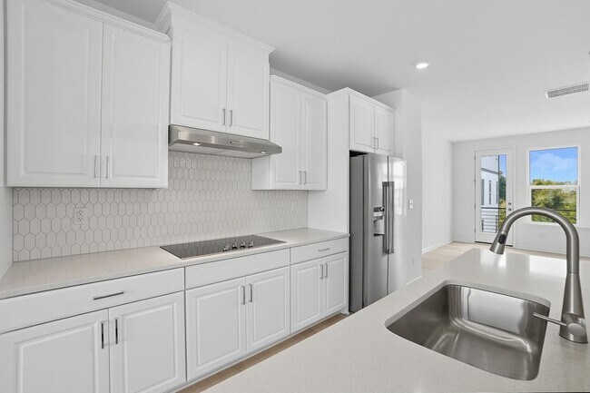 Building Photo - Brand-new three-story townhome in the Univ...