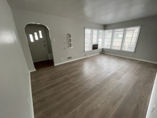 Upstairs living room with new vinyl flooring - 1831 Smith St