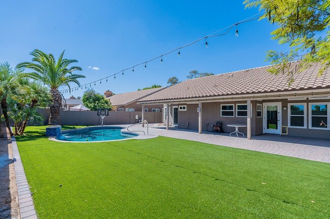 Building Photo - Charming 4-Bedroom Home with Luxurious Poo...