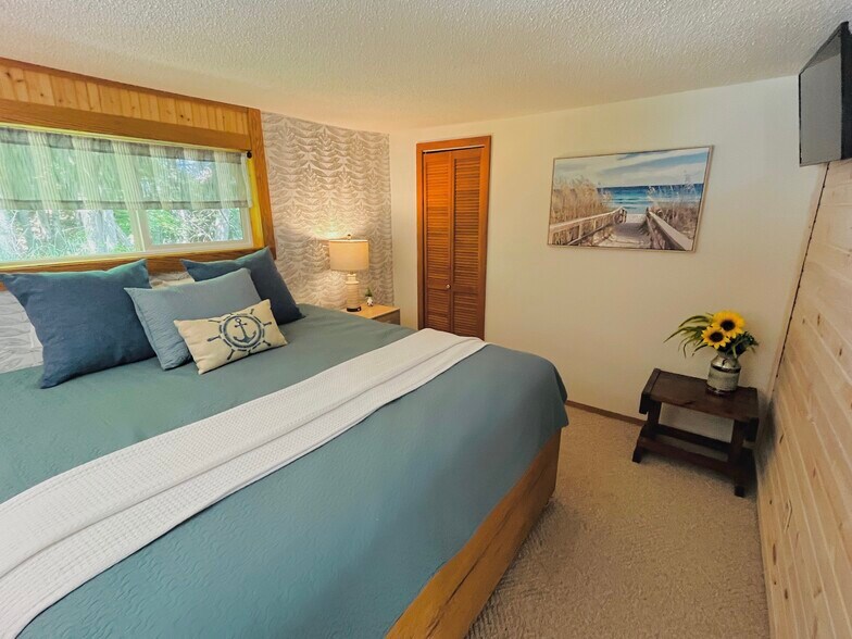 Primary bedroom with King bed and walk in closet - 6023 Barnhart Rd