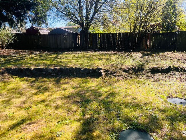 Building Photo - Charming 3BR/1BA w/ 1-car garage, long driveway, fenced yard, wood stove & shed/workshop.