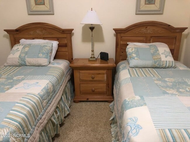 Building Photo - FULLY FURNISHED CONDO in sought-after Sea Trail subdivision!