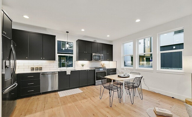 Building Photo - "Charming 3-Bedroom Gem in Seattle's Vibrant Heart - 1733 Sq. Ft. of Modern Comfort!"