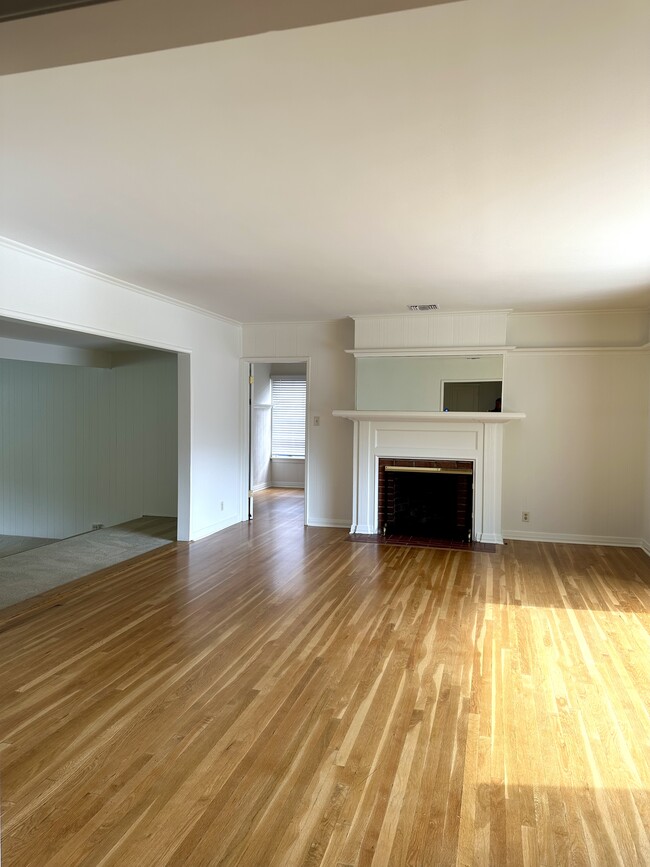 Light-filled living room opens to family room. Den/library4th bedroom behindp - 5182 Woodley Ave