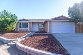 Building Photo - Spacious Three Bedroom, Two Bathroom House featuring Two Car Garage With Huge Yard