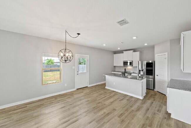 Building Photo - 4 Bedroom Corner Lot Rental with Spacious ...