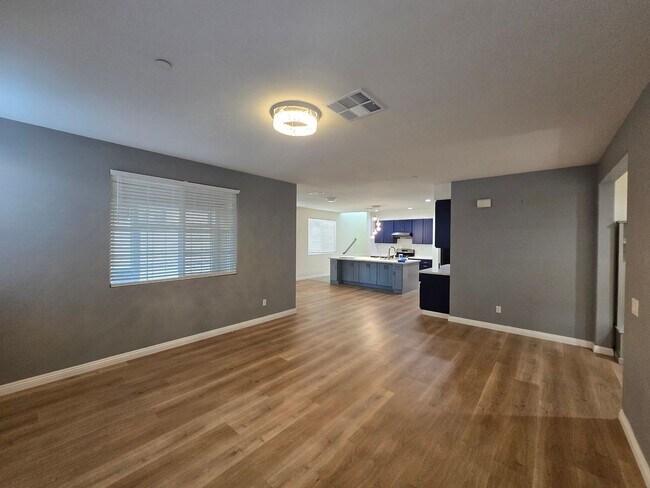 Building Photo - Open-Concept Living with Downstairs Bedroom & Enclosed Patio Retreat