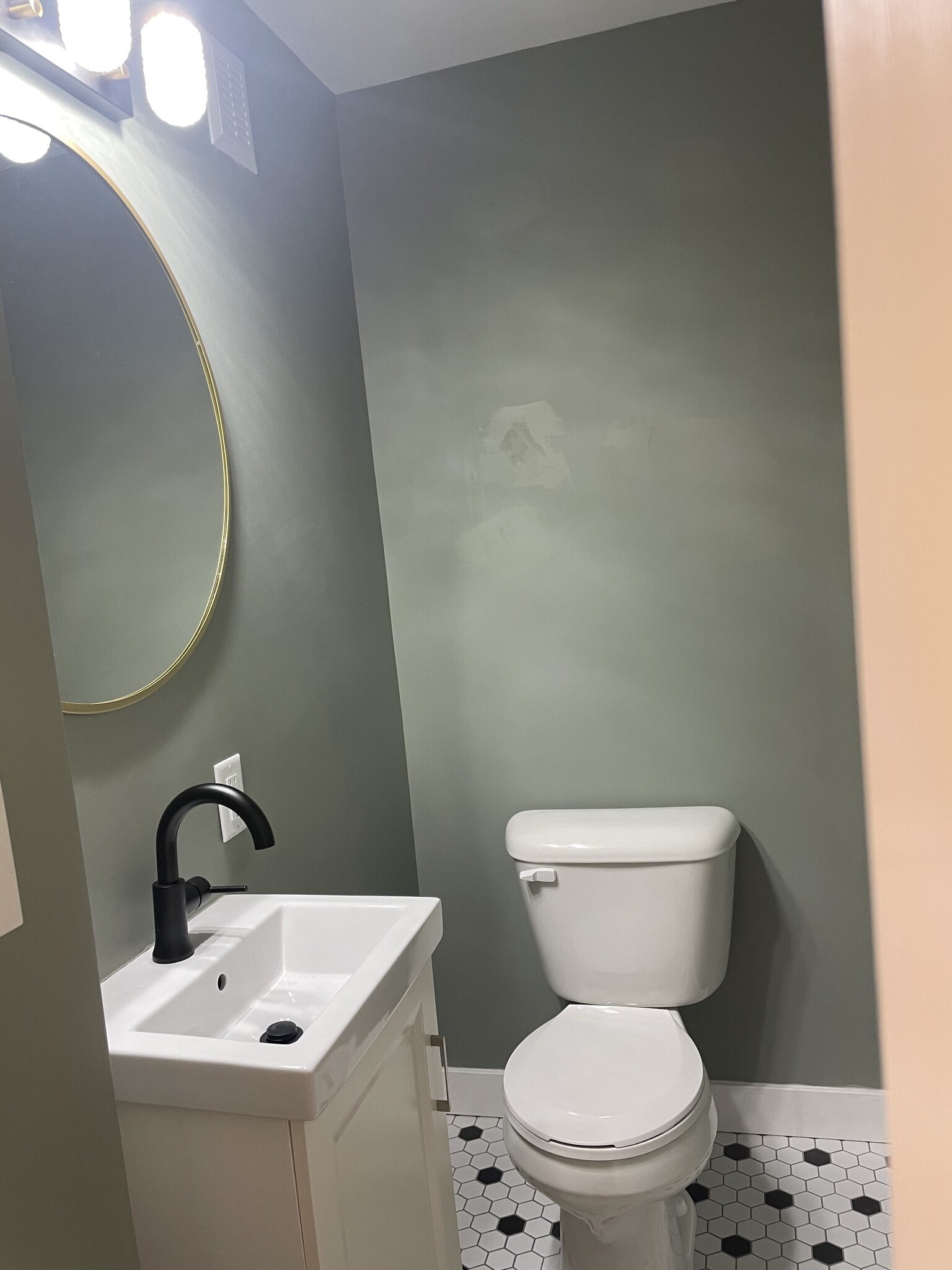 1/2 bath main floor - 107 W 13th St